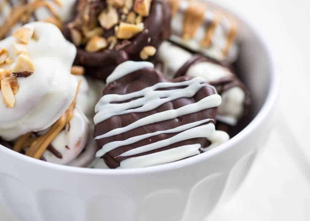 chocolate dipped reese\'s pretzels in bowl