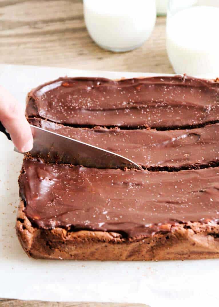 cutting fudge brownies with a knife 