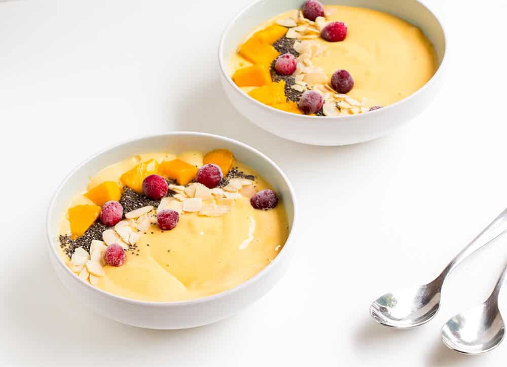 Mango smoothie in bowls. 