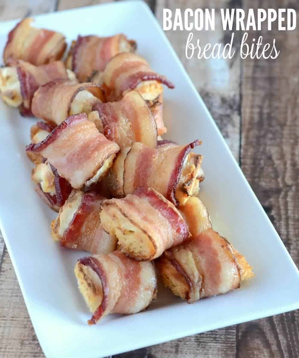 Bacon Wrapped Bread Bites - These easy, tasty appetizers have just three ingredients and they are sure to be a hit at any party! A plate full of bacon-wrapped bread bites.