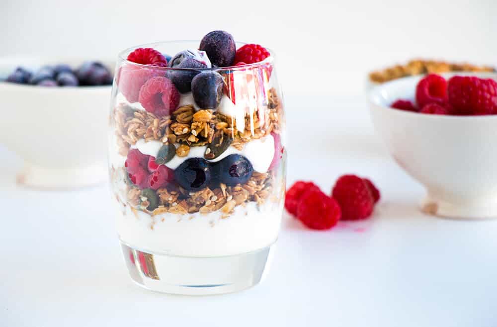 A yogurt parfait on the counter.