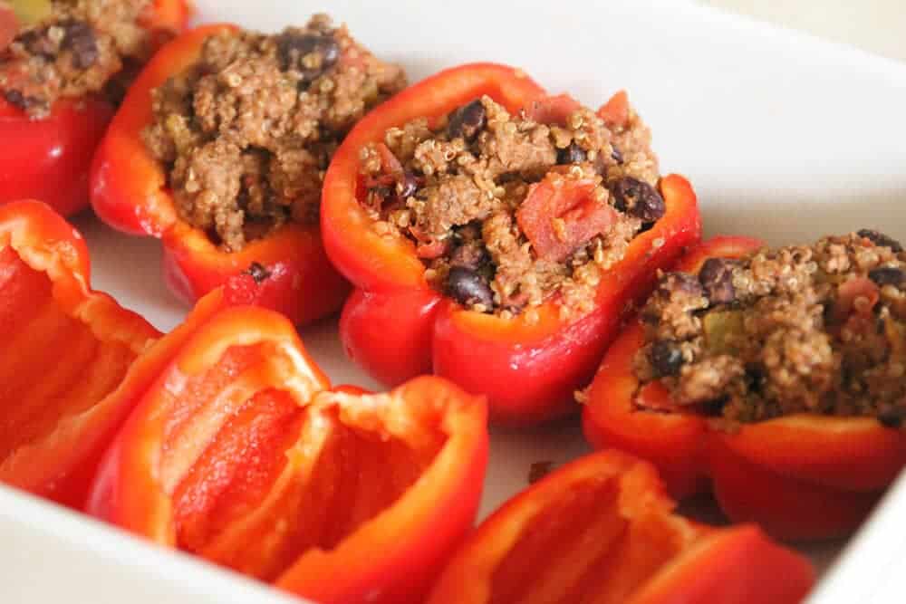 adding filling to bell pepper halves 