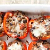 Stuffed Bell Peppers with Quinoa - a delicious, healthy, and quick meal my whole family enjoyed (I was pleasantly surprised that the kids ate these happily and quickly!)