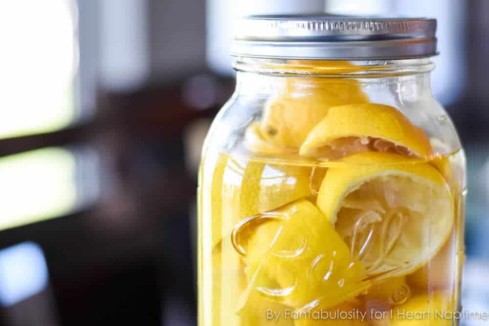 Jar of homemade vinegar and lemon cleaner.