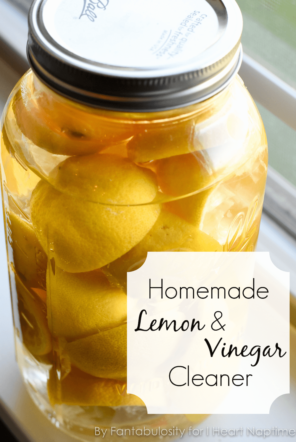 Lemon and vinegar cleaner in a glass mason jar.