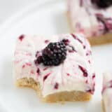 blackberry cheesecake bar with a fresh blackberry on top