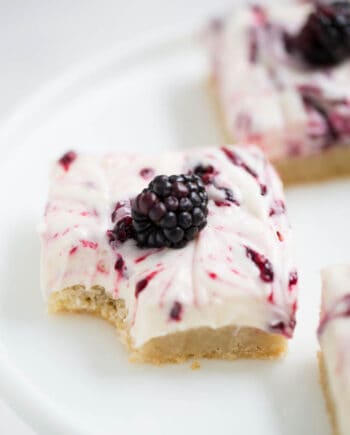 blackberry cheesecake bar with a fresh blackberry on top