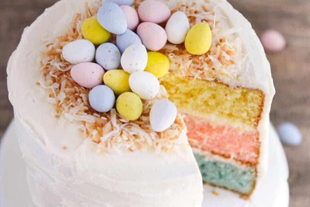 Easter egg cake with a slice taken out. 