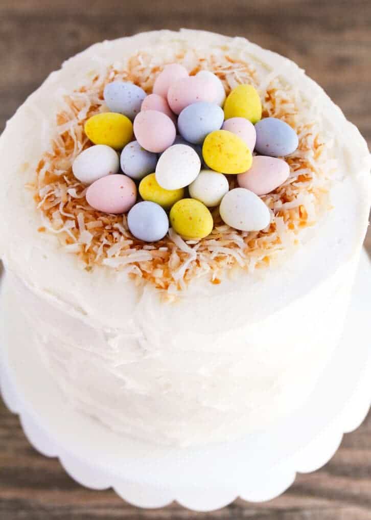 easter cake topped with toasted coconut and mini cadbury eggs 