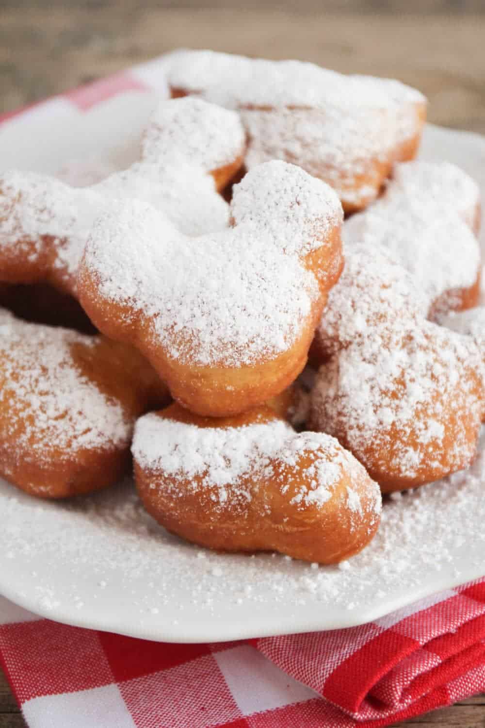 Plate full of mickey mouse beignets.