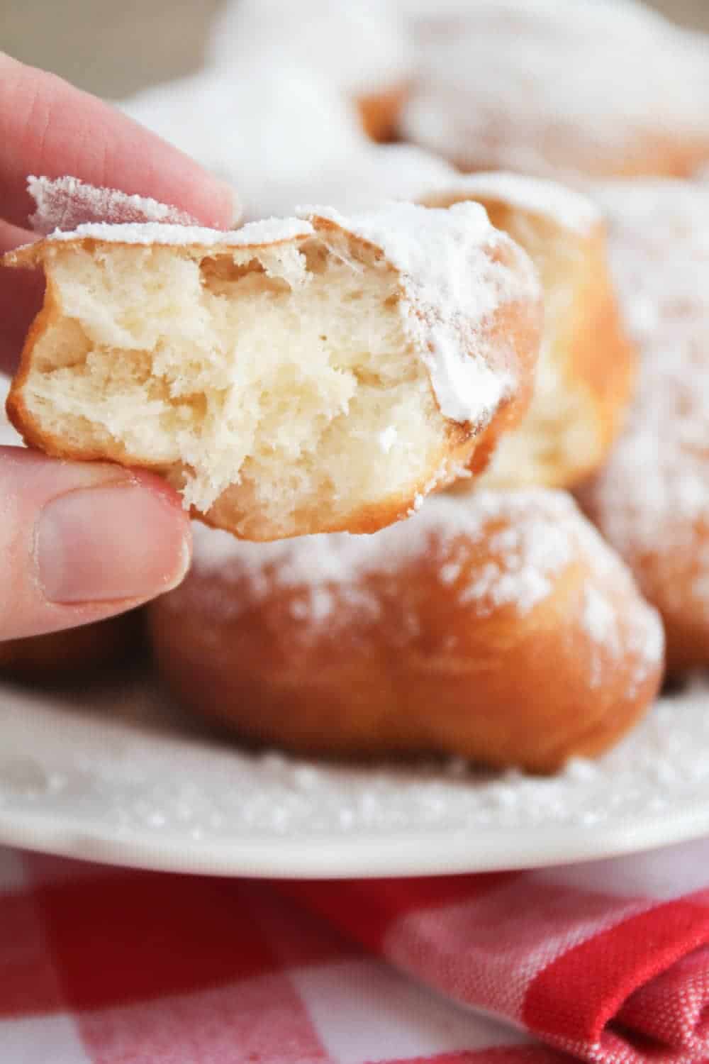 Mickey beignet with a bite taken out.