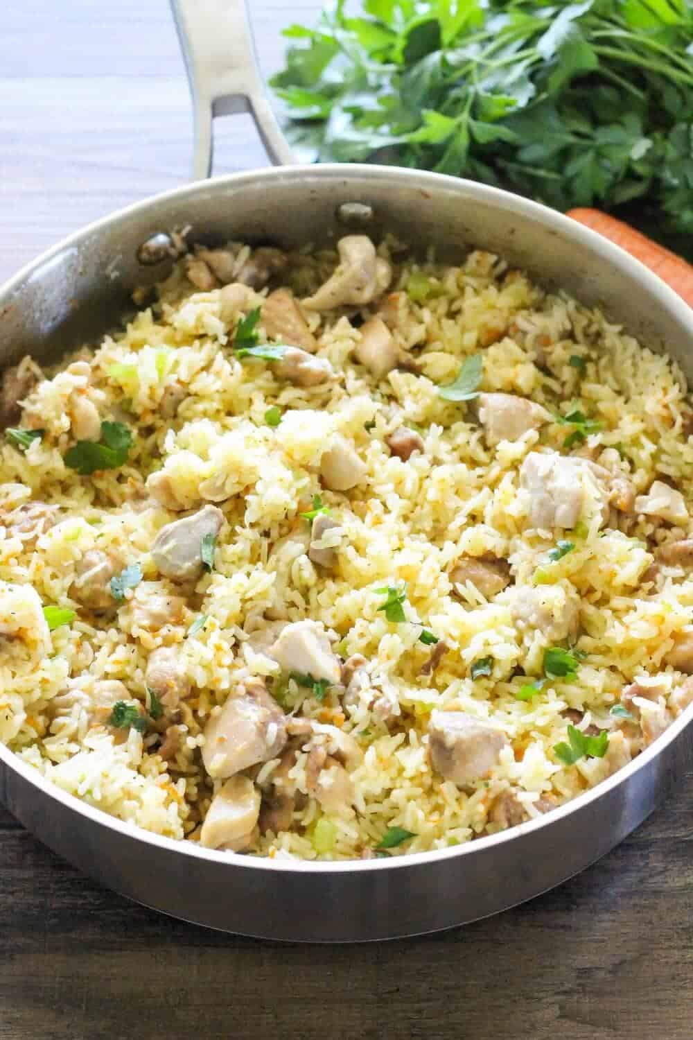 chicken and rice in a skillet on the counter 