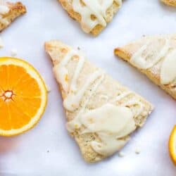Glazed orange scones recipe... sweet and soft bakery-style scones topped with a fresh orange juice glaze.