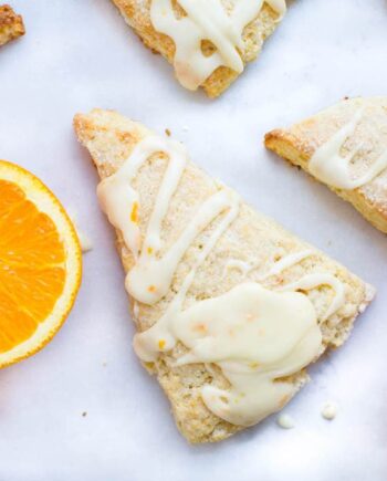 Glazed orange scones recipe... sweet and soft bakery-style scones topped with a fresh orange juice glaze.