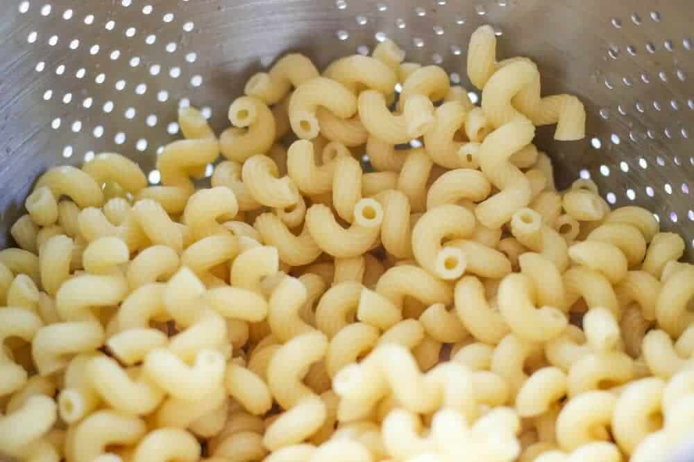 Cavatappi pasta in strainer.