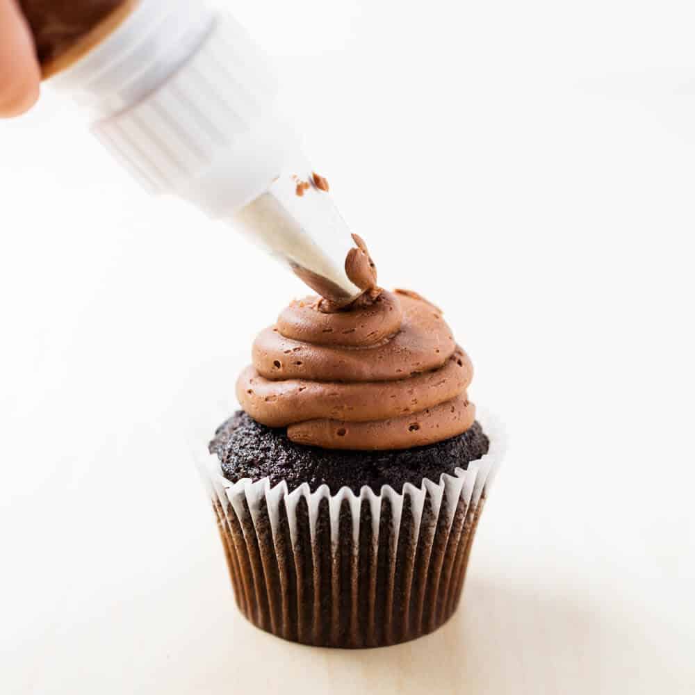 Chocolate buttercream frosting on chocolate cupcake.