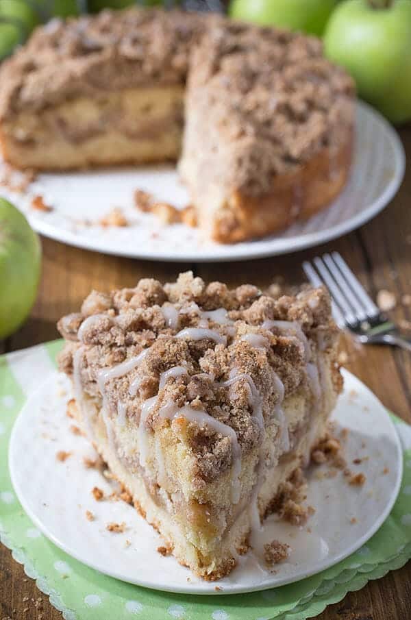 piece of cinnamon apple crumb cake on a white plate 