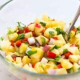 This grilled pineapple salsa is super easy to make and jam packed with flavor – and only takes 5 ingredients to make. It's perfect for summer BBQs as either an appetizer or also tastes amazing on top of hot dogs.