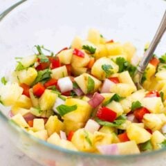 This grilled pineapple salsa is super easy to make and jam packed with flavor – and only takes 5 ingredients to make. It's perfect for summer BBQs as either an appetizer or also tastes amazing on top of hot dogs.