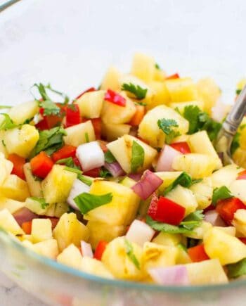 This grilled pineapple salsa is super easy to make and jam packed with flavor – and only takes 5 ingredients to make. It's perfect for summer BBQs as either an appetizer or also tastes amazing on top of hot dogs.