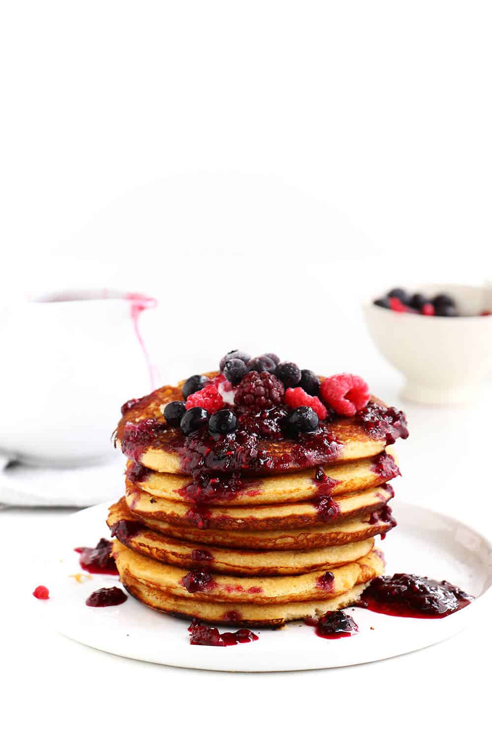 stack of pancakes with fresh berries on top 