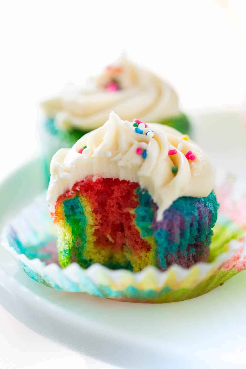 rainbow cupcake with bite taken out of center