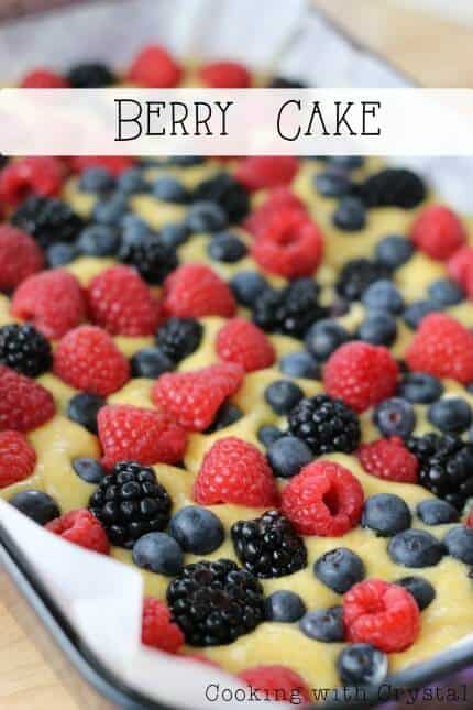 A cake with fresh berries on top 
