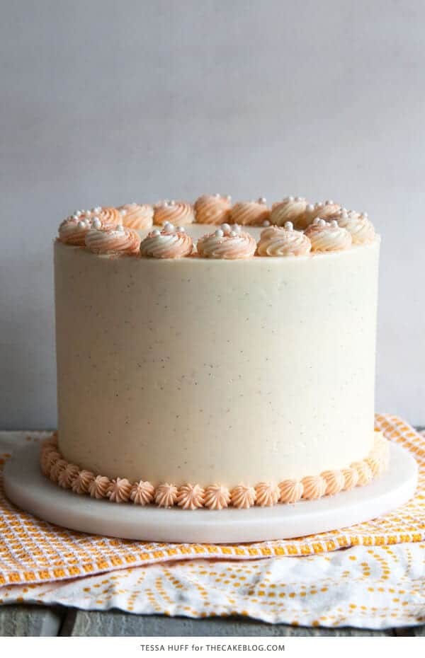 orange creamsicle cake sitting on top of a table