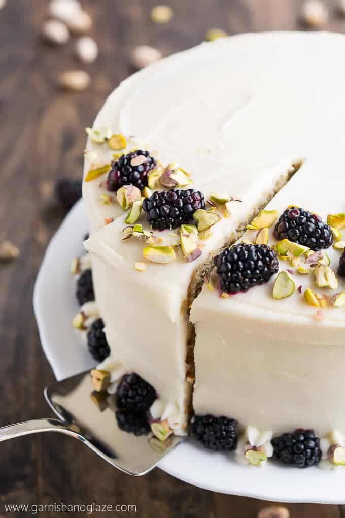 slicing a piece of pistachio cake 