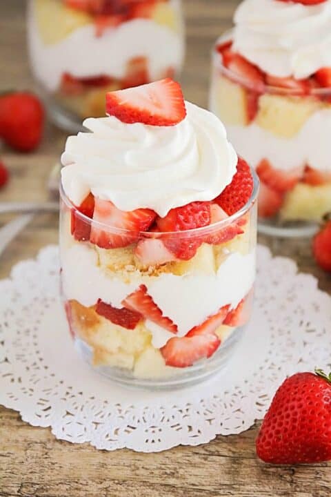 mini strawberry shortcake trifle with whipped cream and sliced strawberry on top
