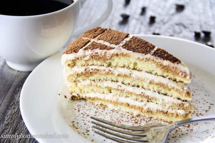 piece of tiramisu on plate with fork 