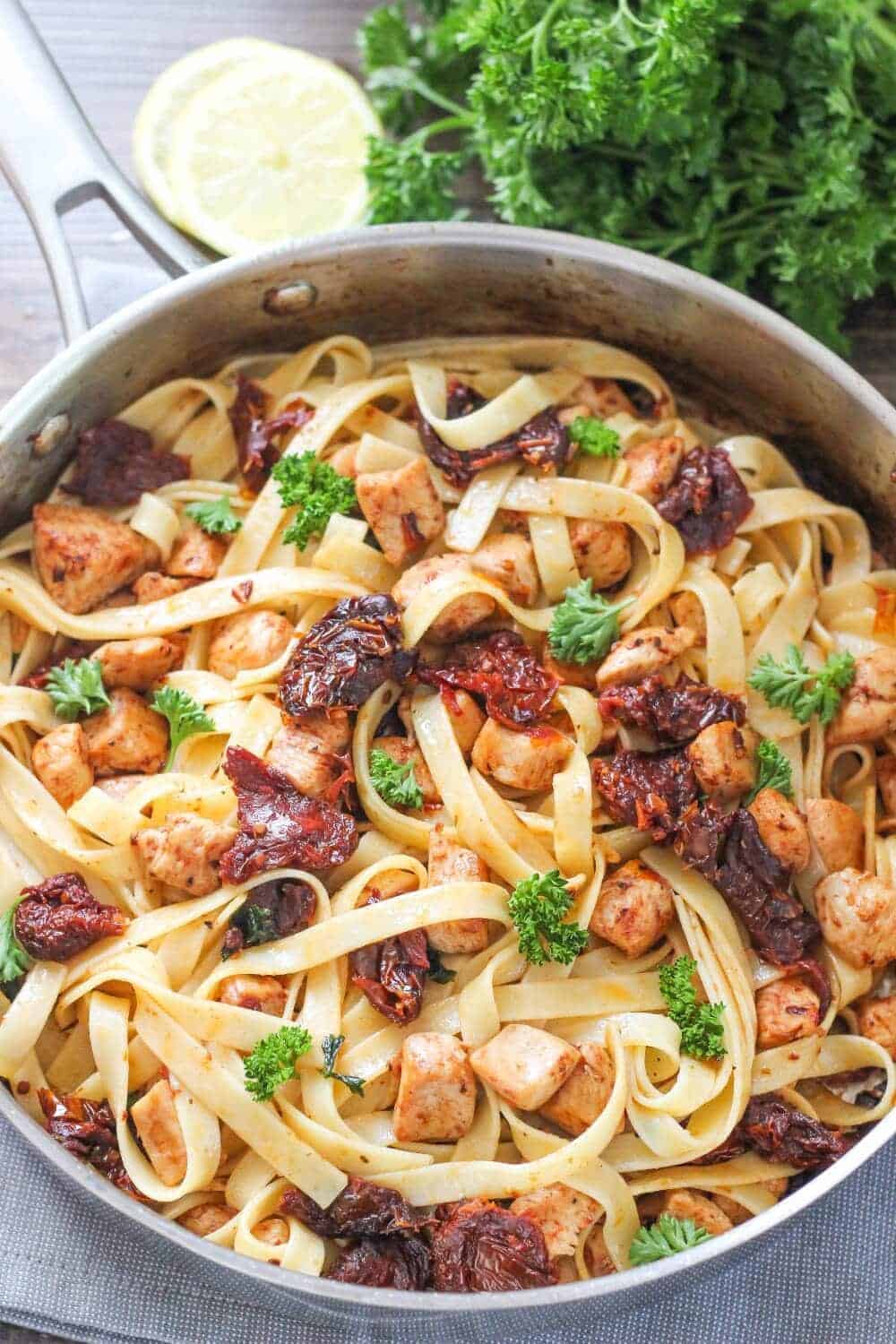 Lemon fettuccine in a skillet.