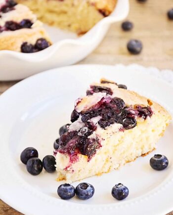 piece of blueberry buttermilk cake on a white plate