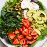 strawberry burrata salad on a white plate