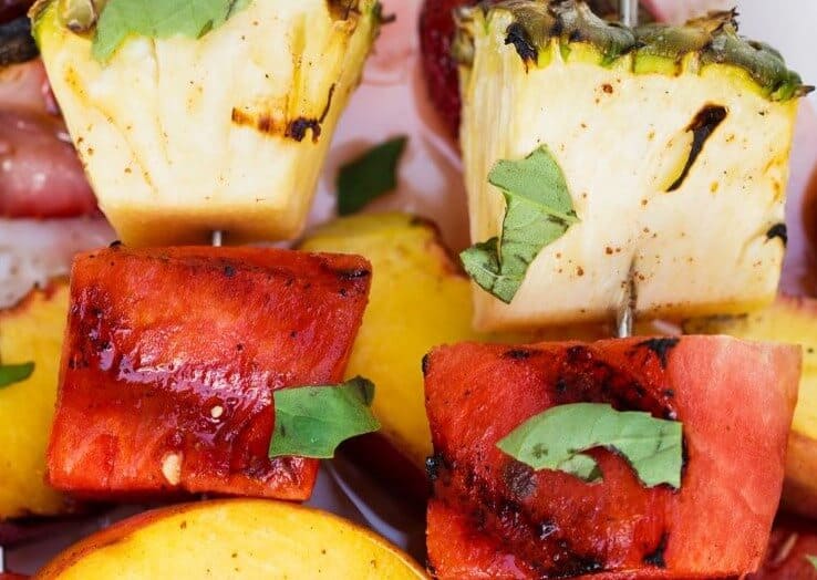 Grilled Fruit Kabobs with a Cinnamon Honey Glaze - So fresh, easy and delicious! These are the perfect healthy side dish or appetizer for any meal and will be a hit with the entire family. fruit kabobs
