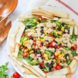 mexican salad on a plate with tortilla strips