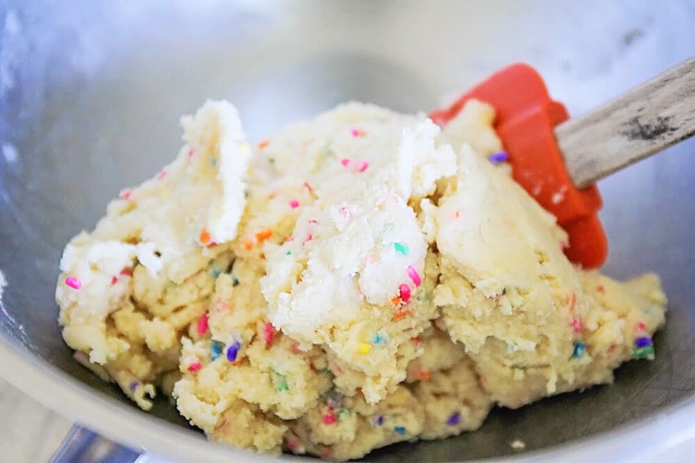 Mixing sugar cookie sprinkle dough.