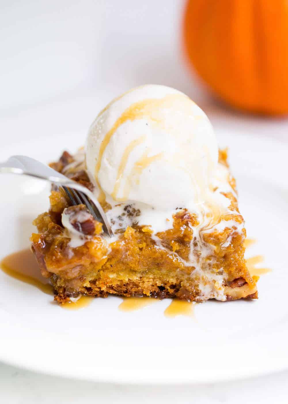 eating pumpkin cake with a fork 