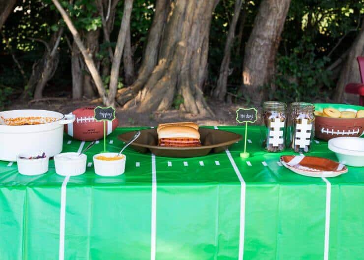 tailgating chili bar with chili, hot dogs and corn dog muffins 