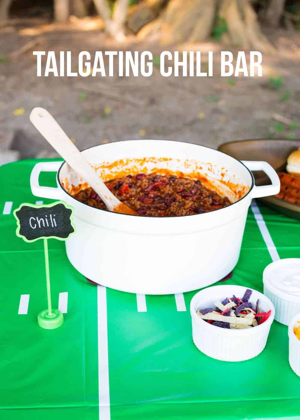 Tailgating chili bar with a pot of homemade chili.