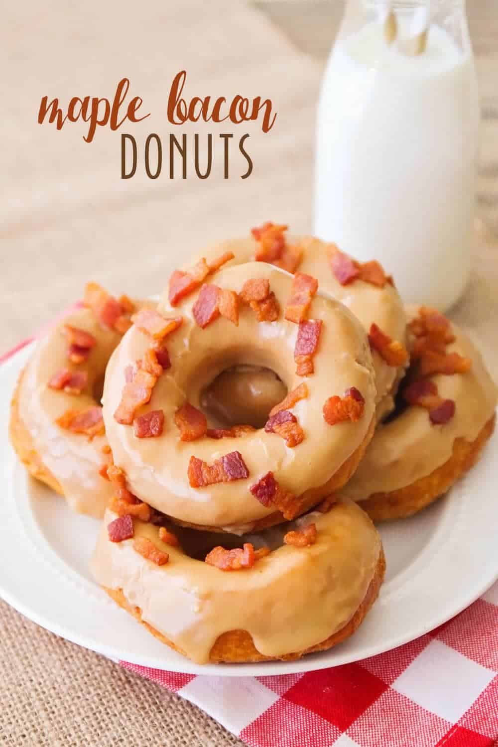 stack of maple and bacon donuts on a white plate 