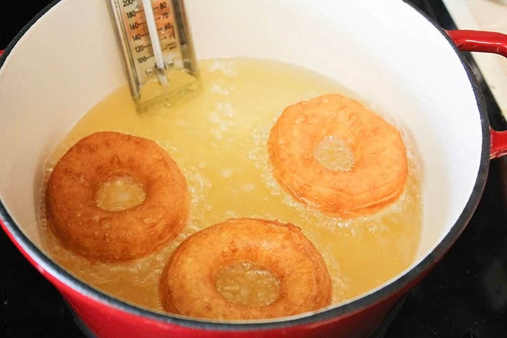 frying maple donuts in oil a large pan 