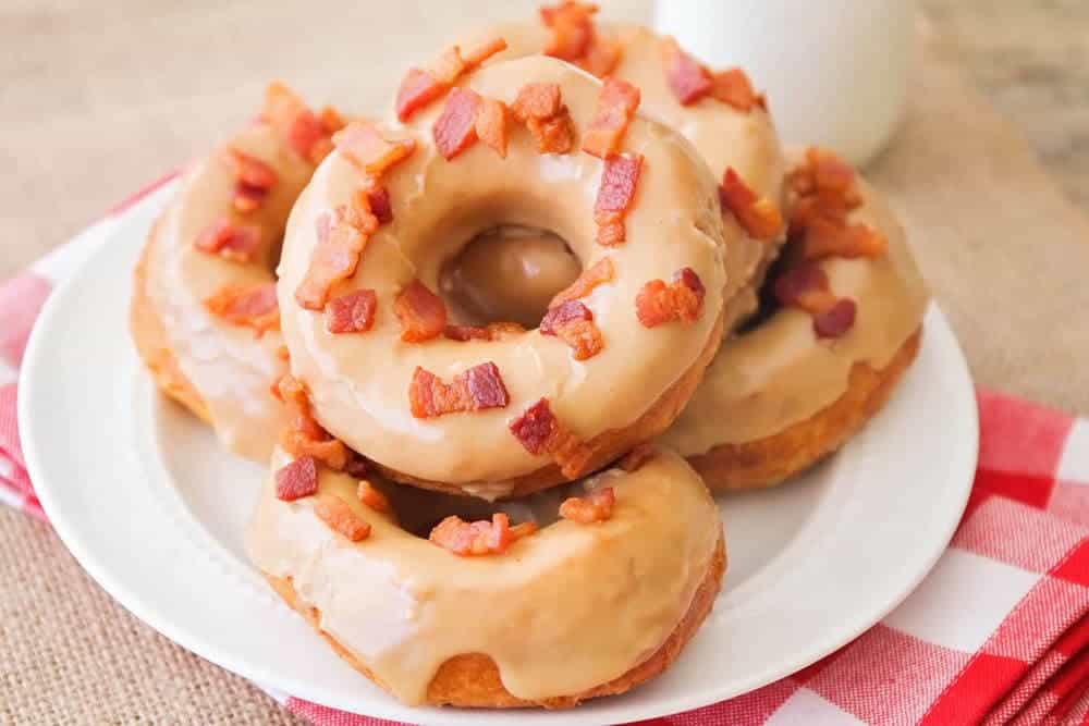 plate of maple and bacon donuts 