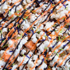 Halloween Candy Popcorn covered in white chocolate mixed with KIT KAT Bars and REESE'S! So delicious!