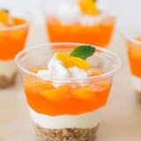 orange pretzel parfait in a small plastic cup