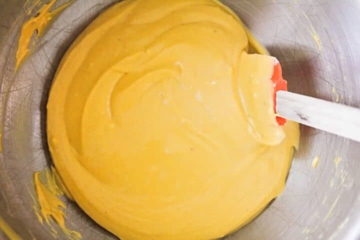 mixing pumpkin cheesecake filling 