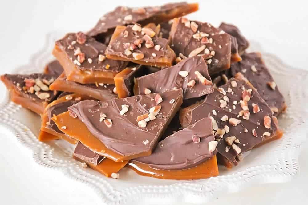 Homemade Toffee... this rich and buttery toffee takes about thirty minutes to make and is super easy too! Perfect for parties, holiday gifts, and snacking!