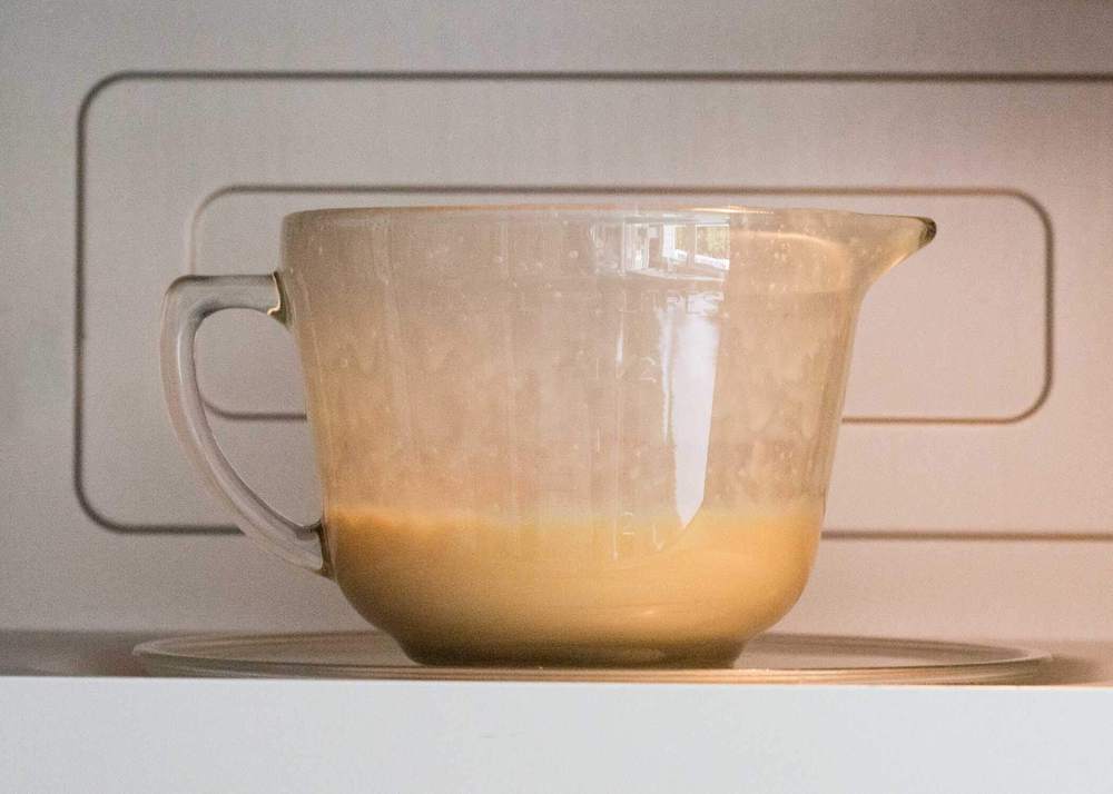 Caramel in bowl in the microwave.