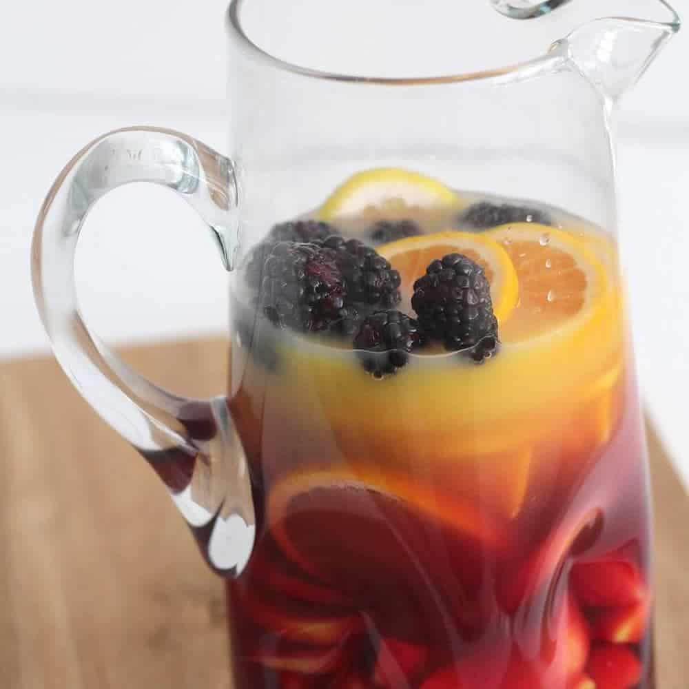 Virgin sangria in a glass pitcher.