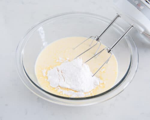 mixing eggnog pie mixture in bowl